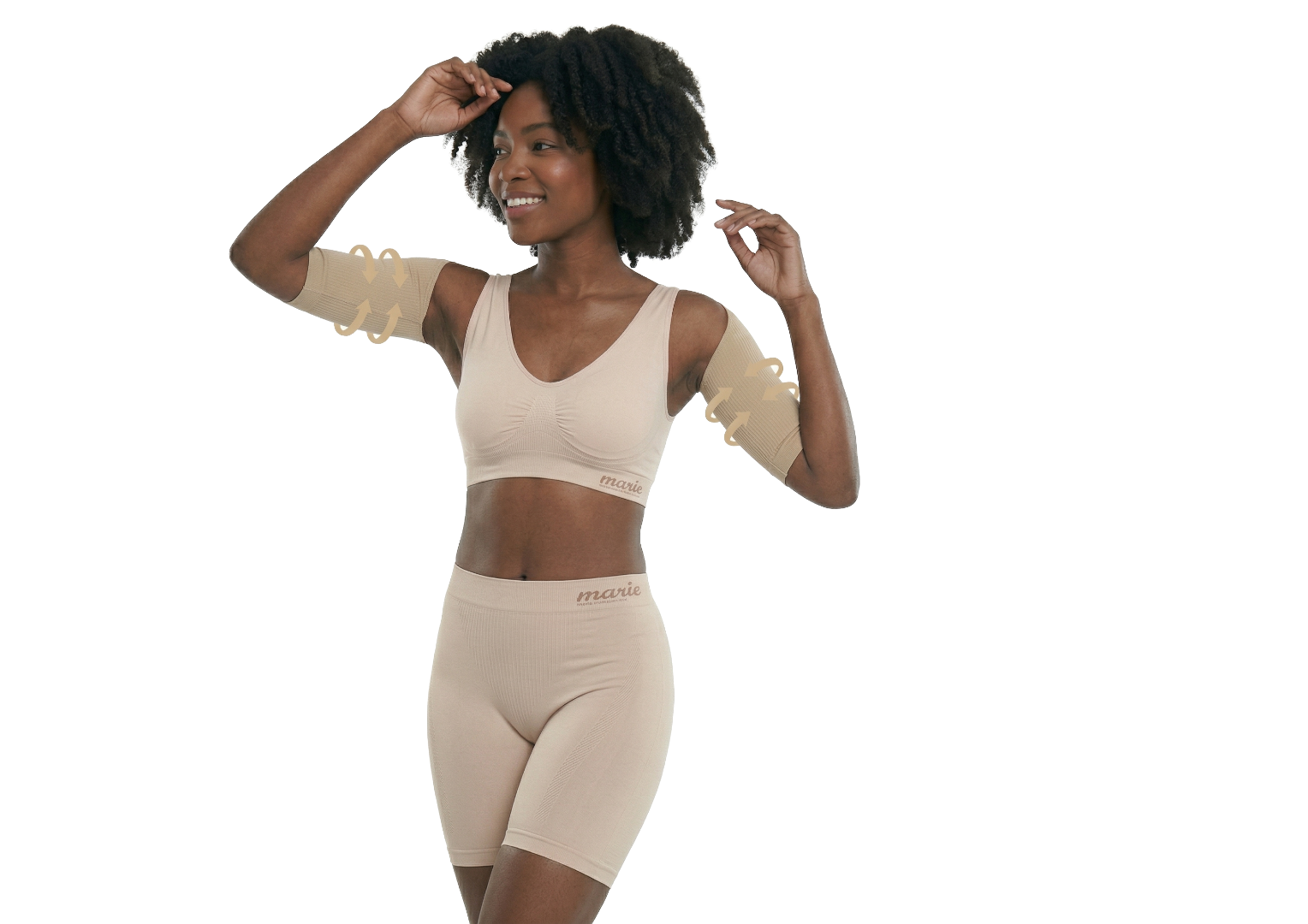 Eine Frau trägt die Marie Shapeweare-Kollektion bestehend aus einem formenden BH, einem Bolero für straffe Oberarme und Shorts für eine definierte Silhouette. Diese Shapewear arbeitet gezielt an den Problemzonen des weiblichen Körpers, wie Beinen, Armen, Po und Dekolleté, um diese zu straffen und das Hautbild zu verbessern. Die Marie-Produkte kombinieren Anti-Aging-Wirkstoffe in Sprays mit Massagenoppen für langanhaltende Straffung und eine effektive Konturierung des Körpers.
